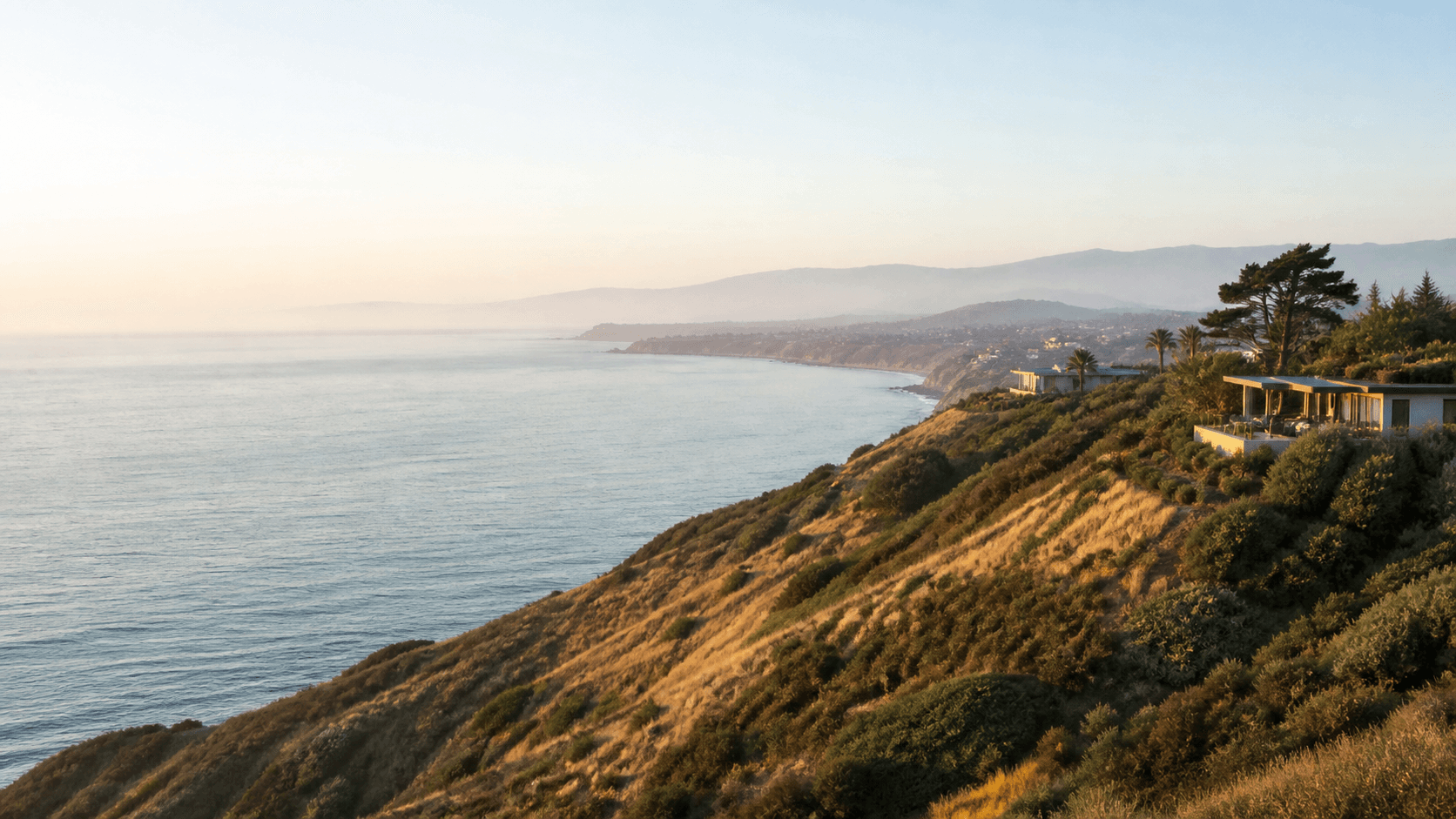 California coastline and hillside neighborhoods.